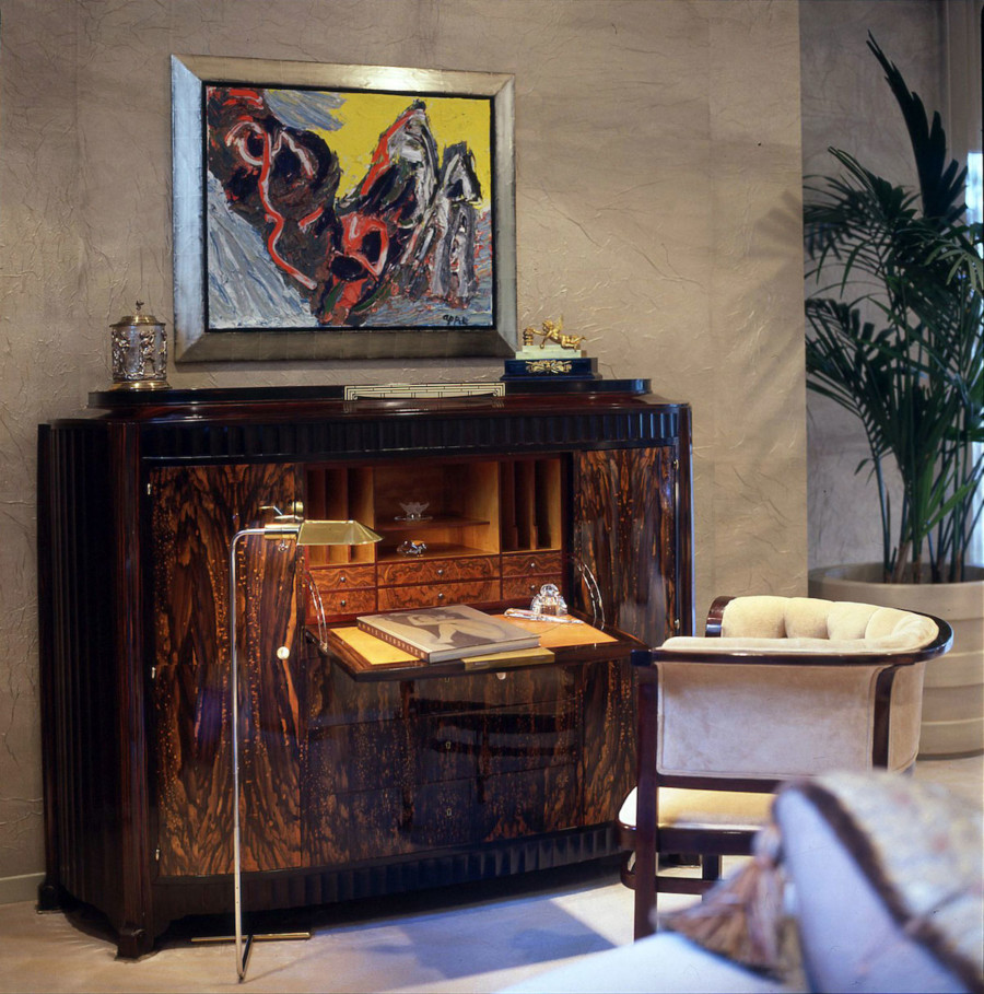 Exquisite secretaire desk by Sue et Mare, Paris, circa 1923. Ebony wood, ivory escutcheons and knobs with Hermes leather used for the writing surface. Chair one of a pair by Josef Hoffmann, circa 1930. Floor lamp by Cedric Hartman, circa 1950s. Walls paneled in pale bronze tea paper.